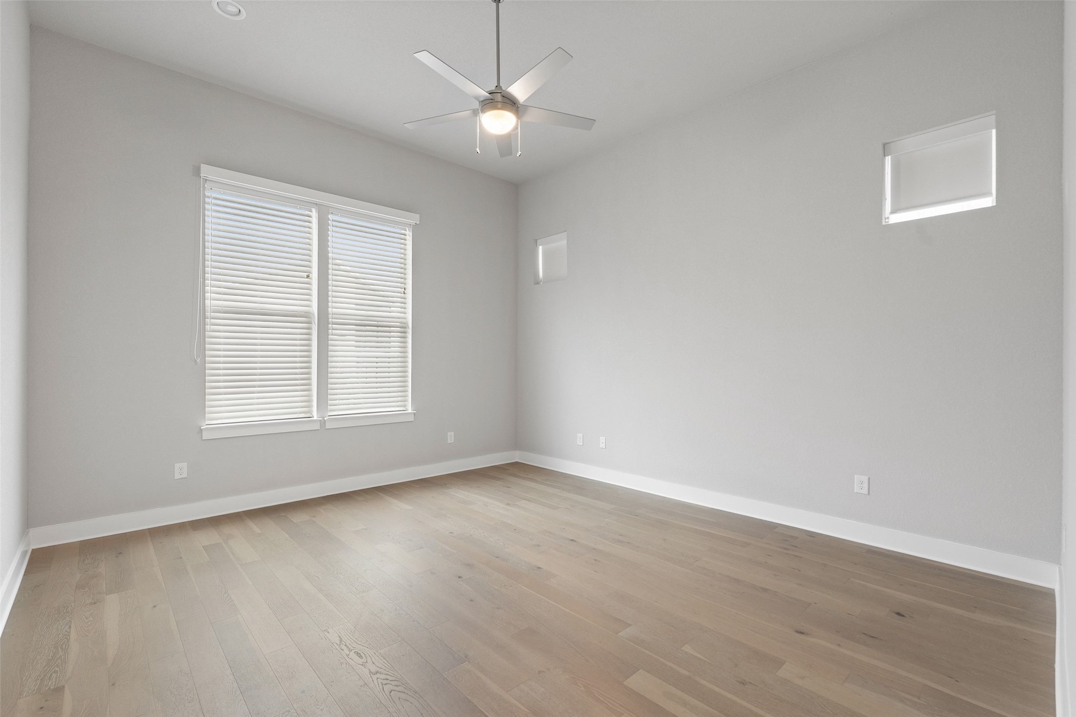 6104 Florencia Lane Austin, TX 78724 - Photo 19 of 31 Empty room featuring ceiling fan and light wood-style flooring