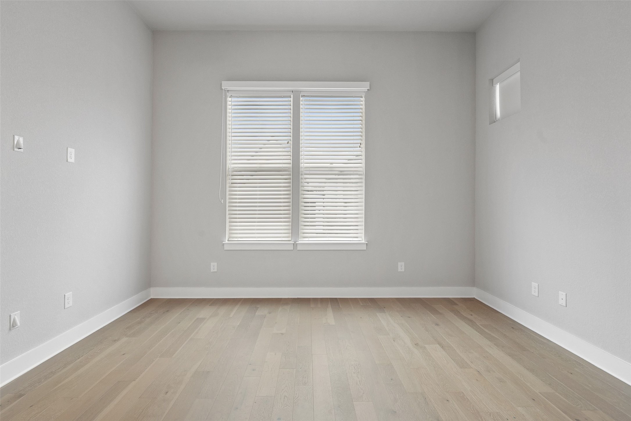 6104 Florencia Lane Austin, TX 78724 - Photo 20 of 31 Spare room featuring light wood-style floors and baseboards