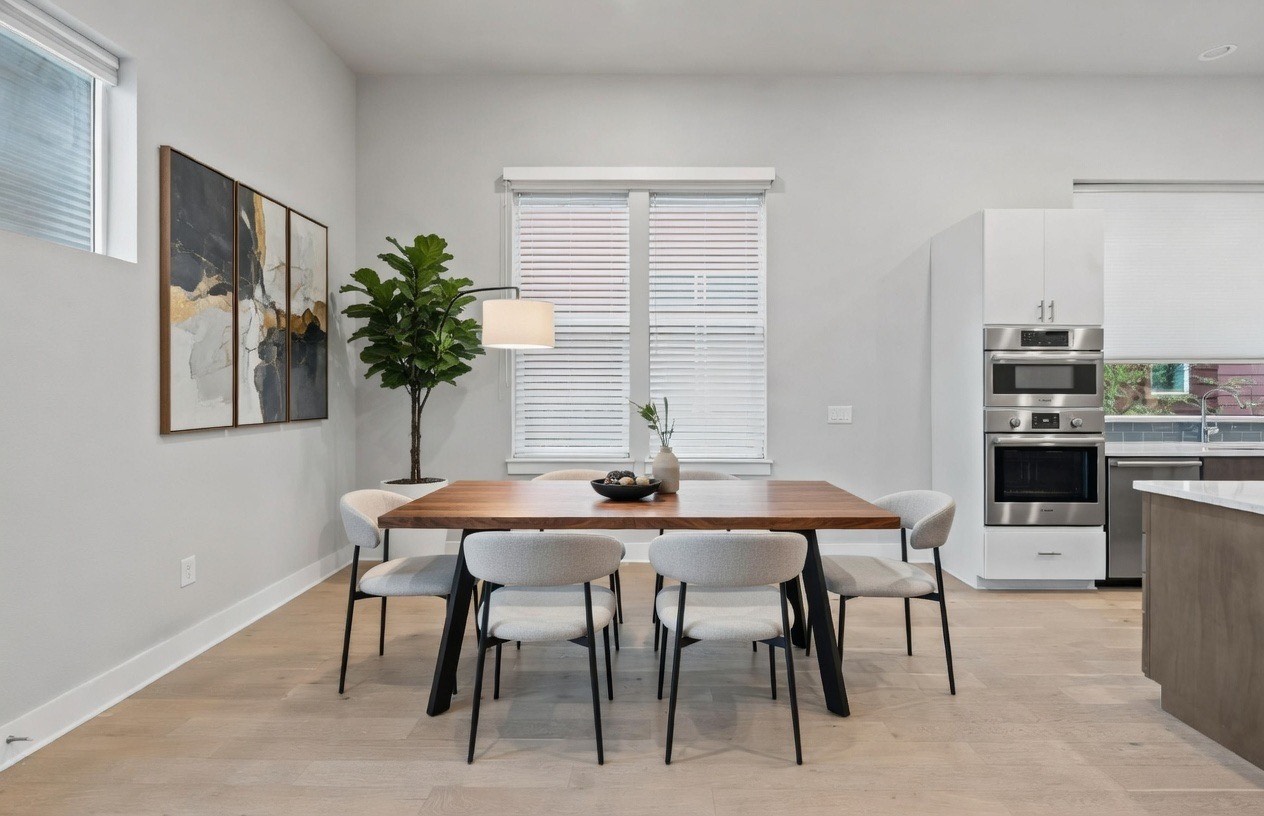 6104 Florencia Lane Austin, TX 78724 - Photo 4 of 31 Dining area featuring light wood-style flooring and baseboards