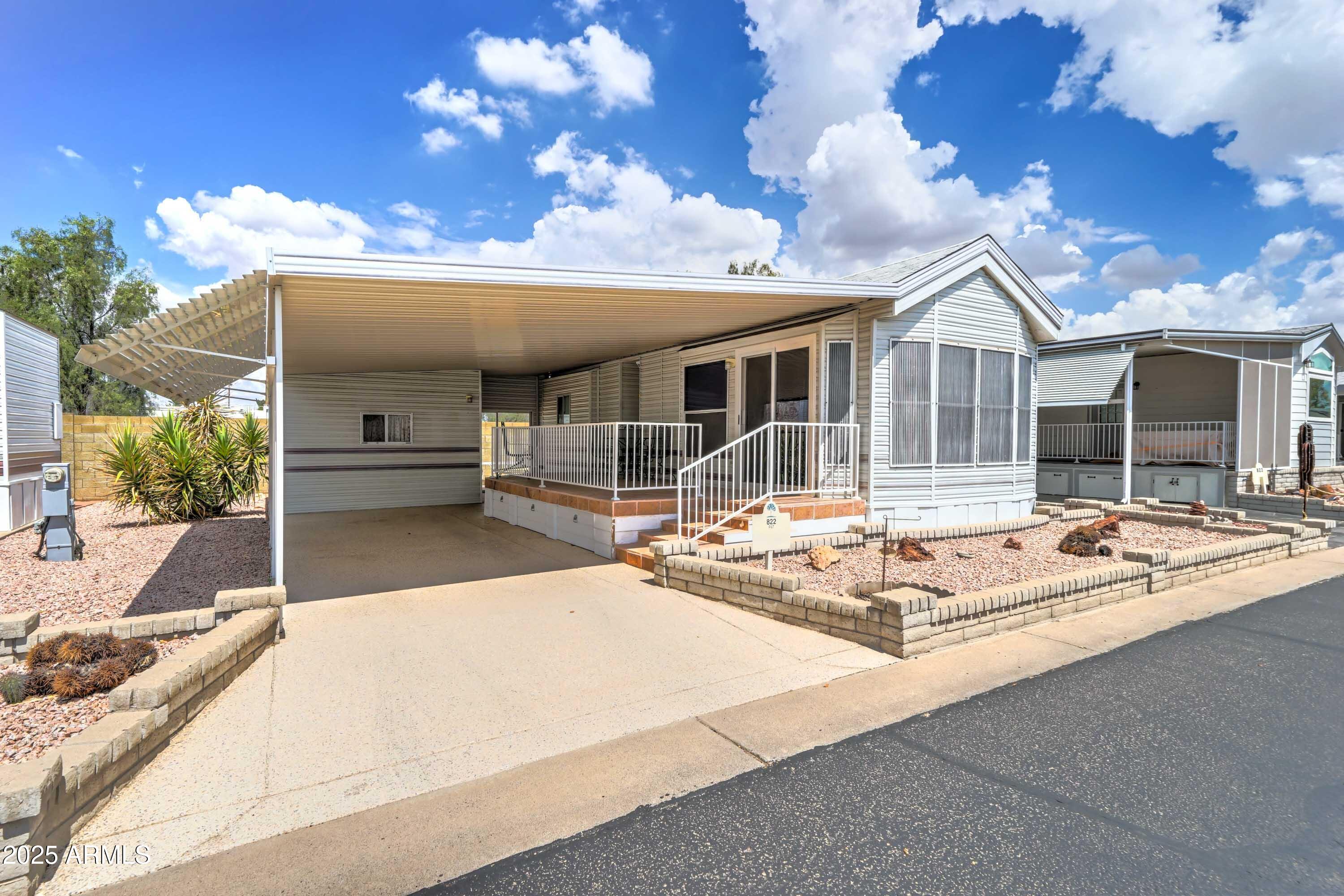a view of a house with backyard patio and fire pit
