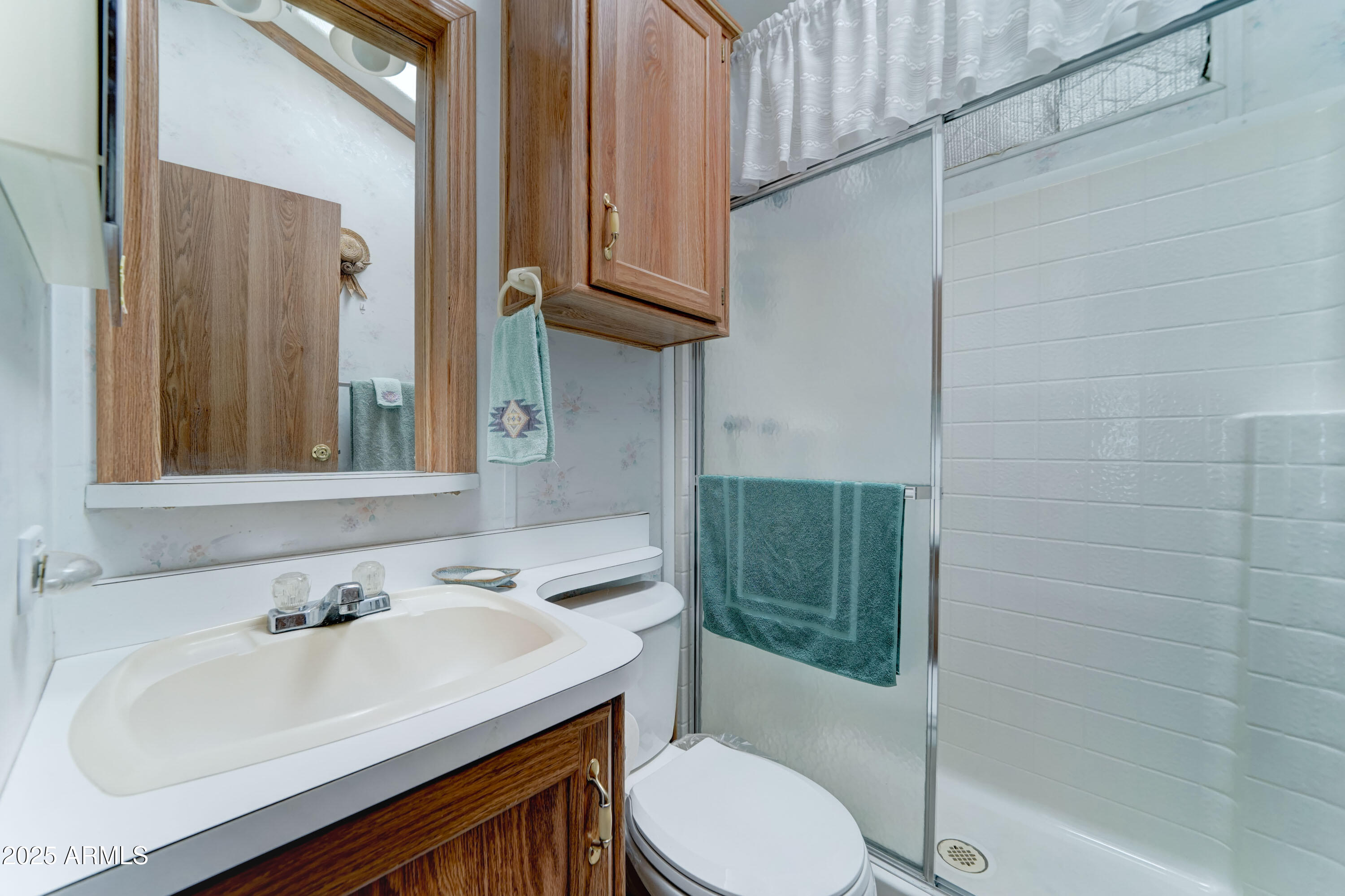 111 South Greenfield Road, Unit 822 Mesa, AZ 85206 - Photo 11 of 25 a bathroom with a sink toilet and shower