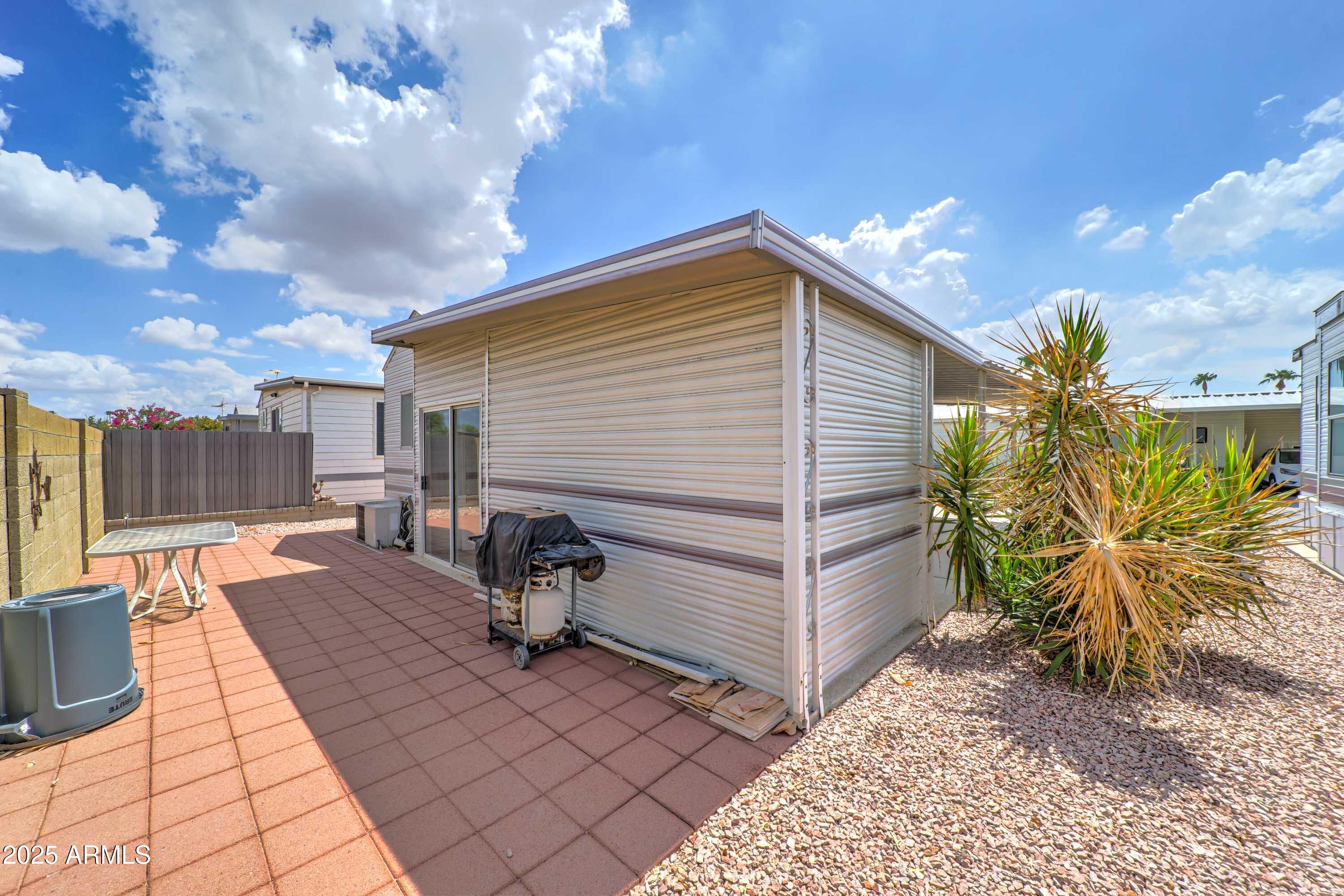 111 South Greenfield Road, Unit 822 Mesa, AZ 85206 - Photo 16 of 25 a view of a backyard with sitting area