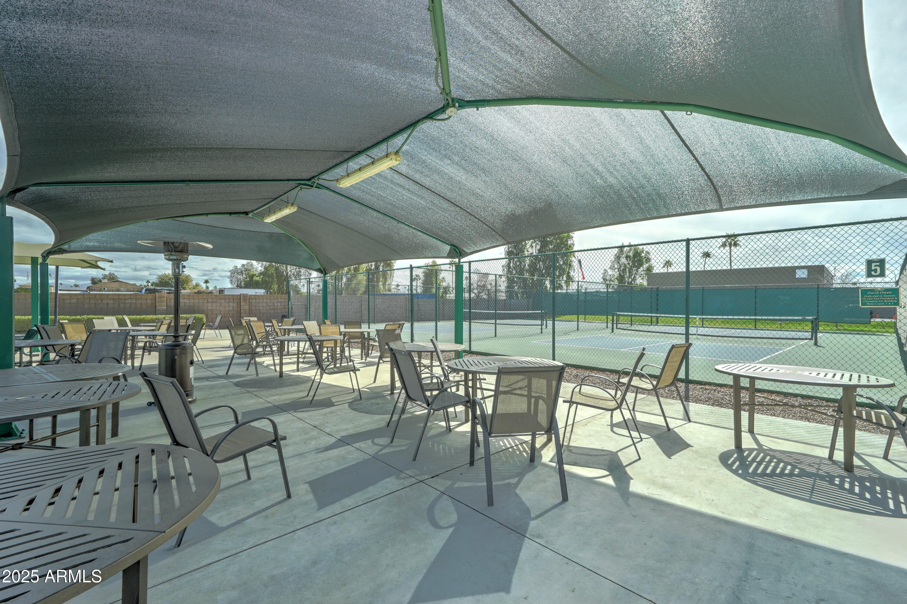 111 South Greenfield Road, Unit 822 Mesa, AZ 85206 - Photo 20 of 25 a view of a porch with chairs and backyard