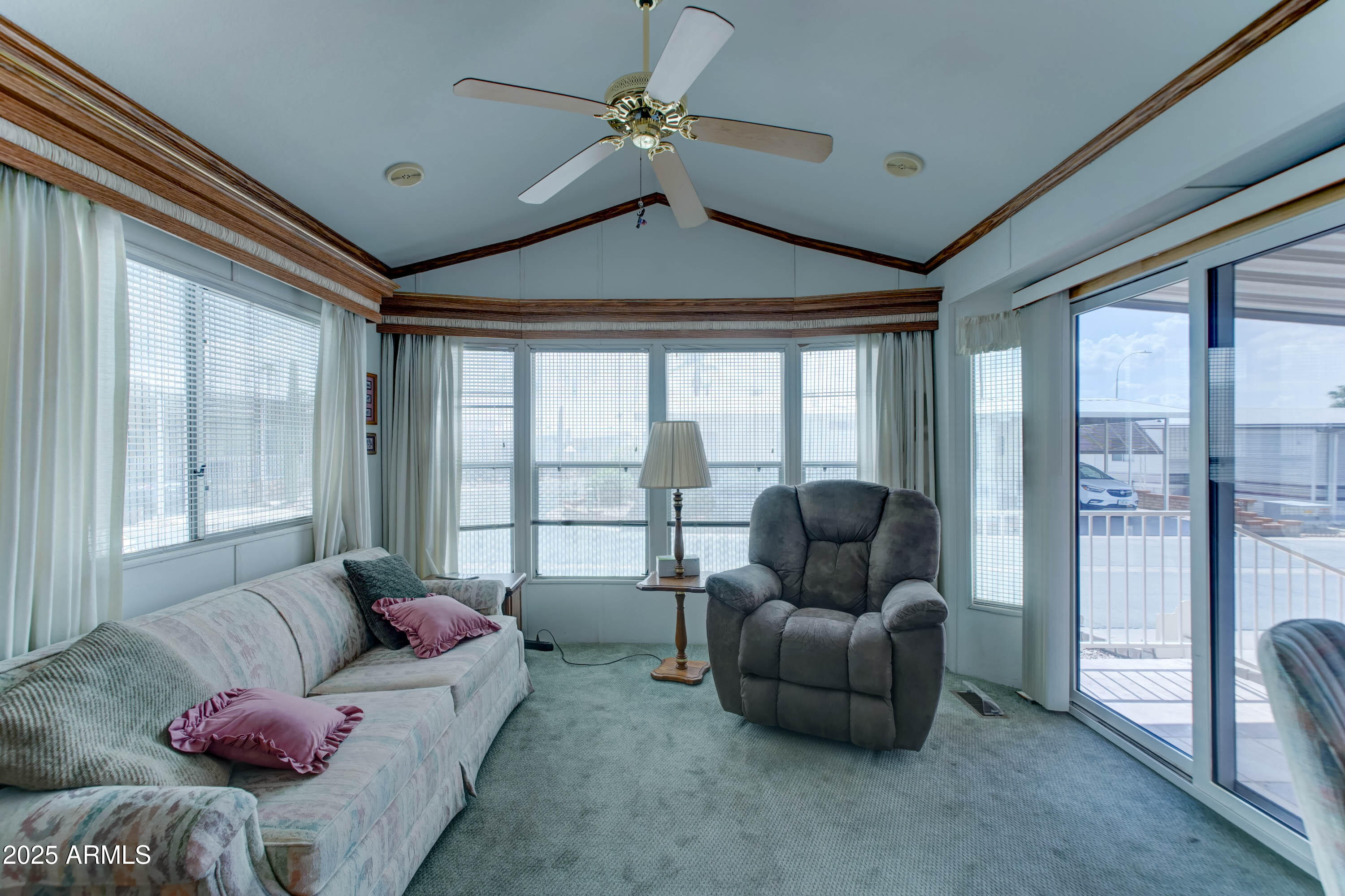 111 South Greenfield Road, Unit 822 Mesa, AZ 85206 - Photo 5 of 25 a living room with furniture and a window