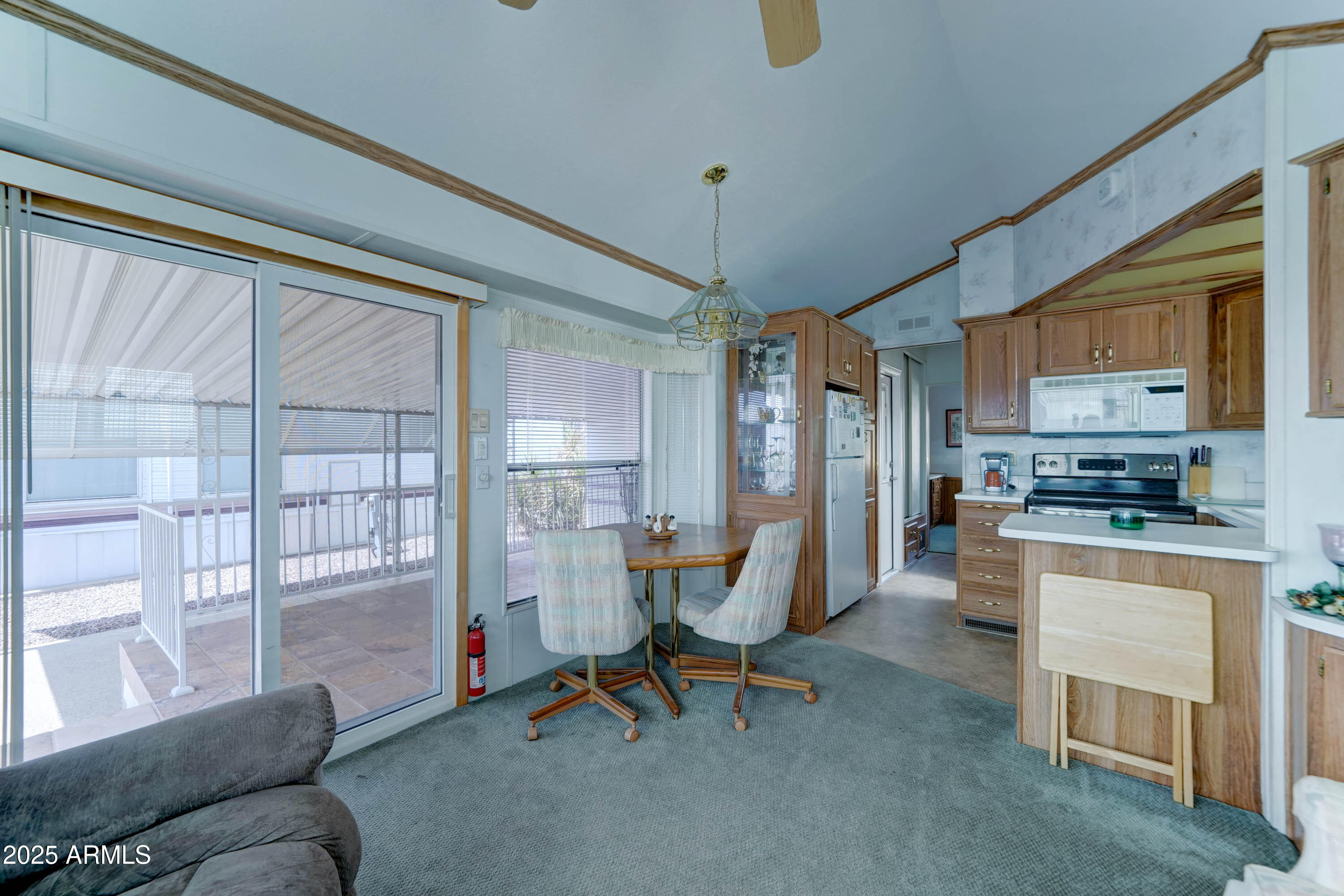 111 South Greenfield Road, Unit 822 Mesa, AZ 85206 - Photo 7 of 25 a view of a livingroom with furniture and a kitchen