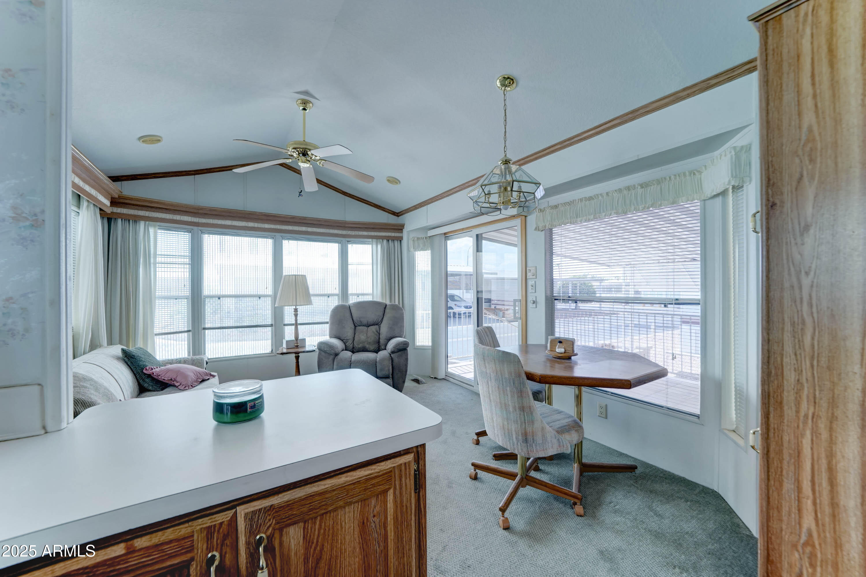 111 South Greenfield Road, Unit 822 Mesa, AZ 85206 - Photo 8 of 25 a view of a workspace with furniture and a window