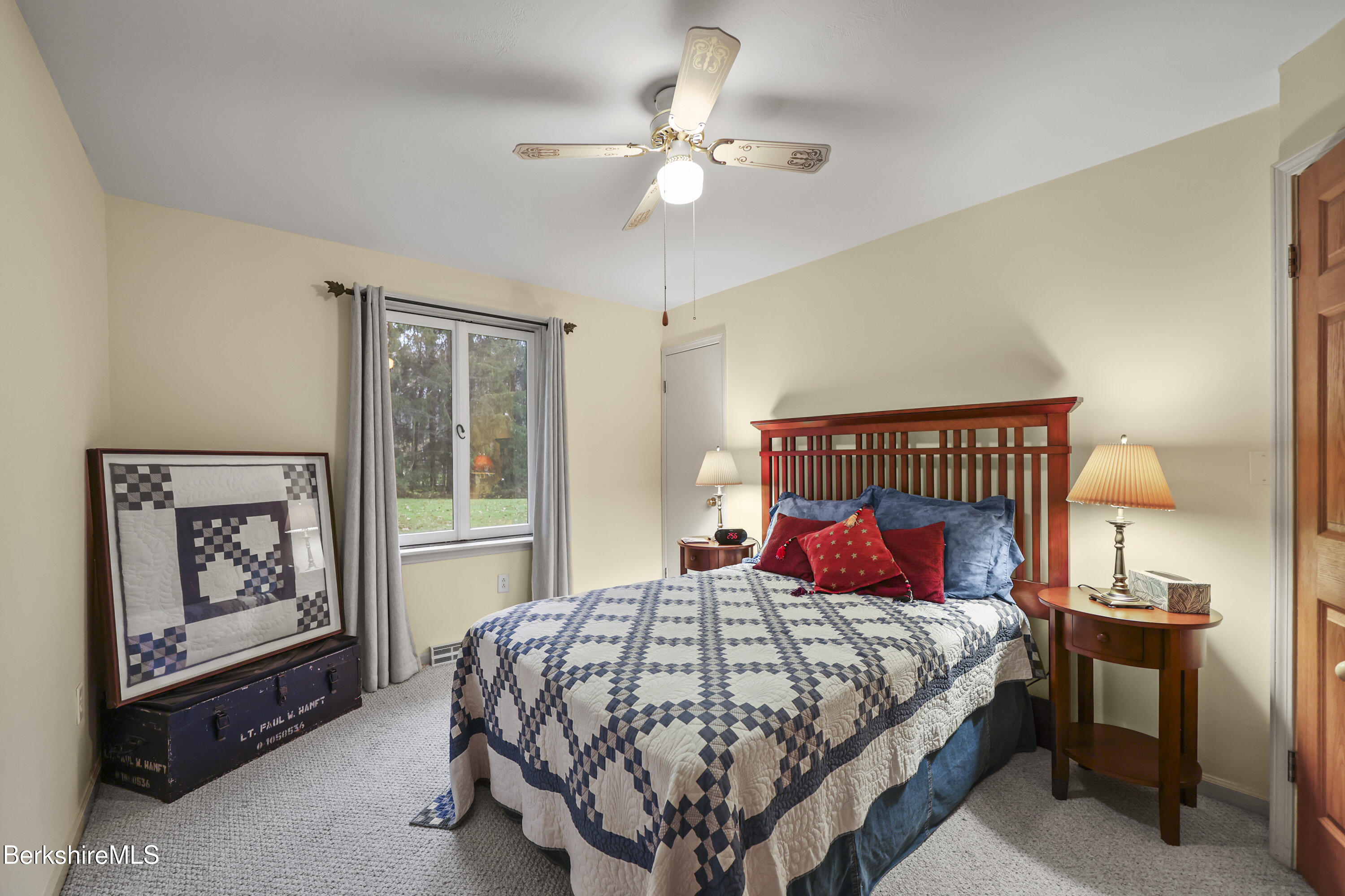 36 West Center Road West Stockbridge, MA 01266 - Photo 17 of 30 a bedroom with a large bed and a chandelier