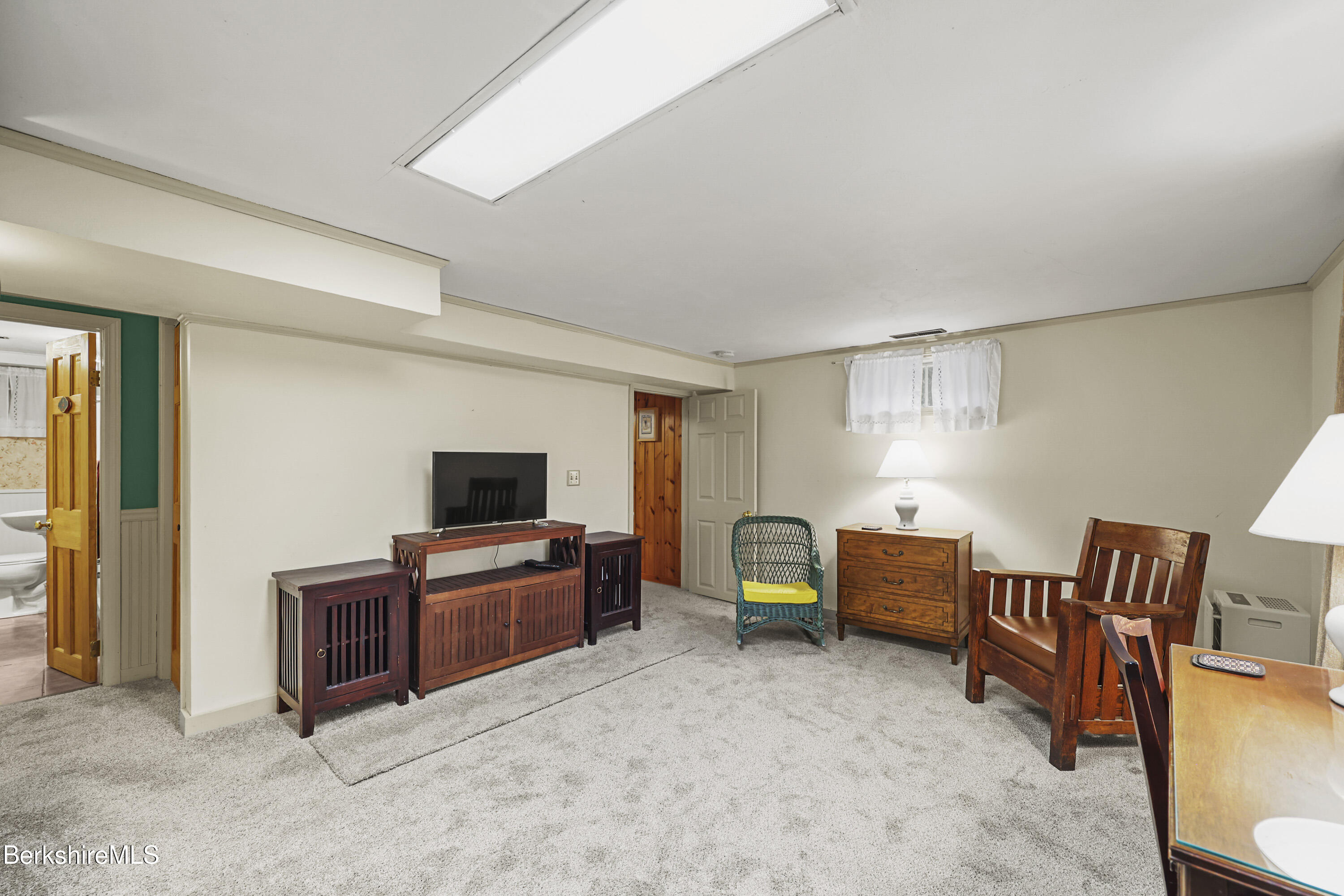 36 West Center Road West Stockbridge, MA 01266 - Photo 22 of 30 a living room with furniture and a flat screen tv