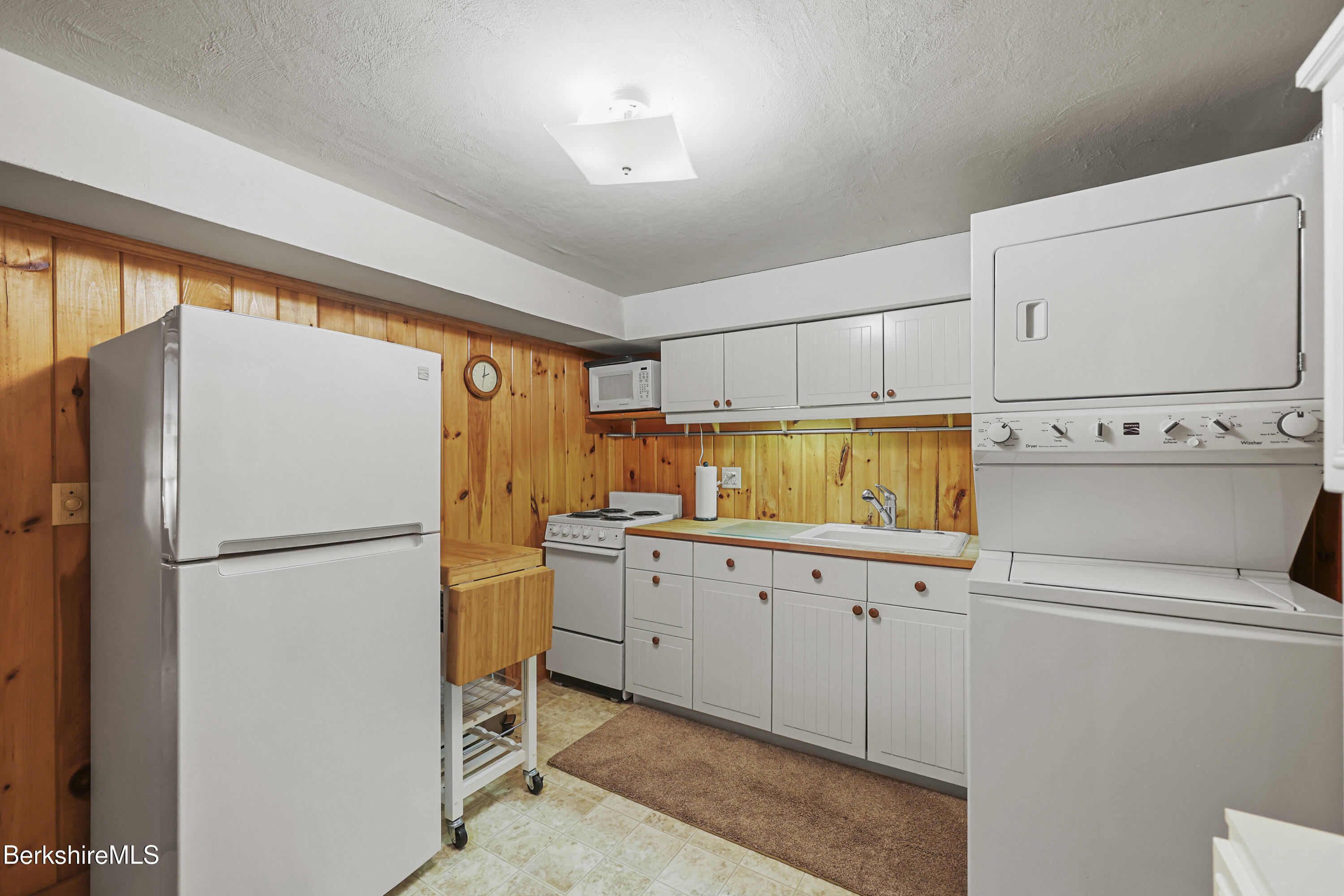 36 West Center Road West Stockbridge, MA 01266 - Photo 24 of 30 a kitchen with granite countertop a refrigerator a sink and white cabinets