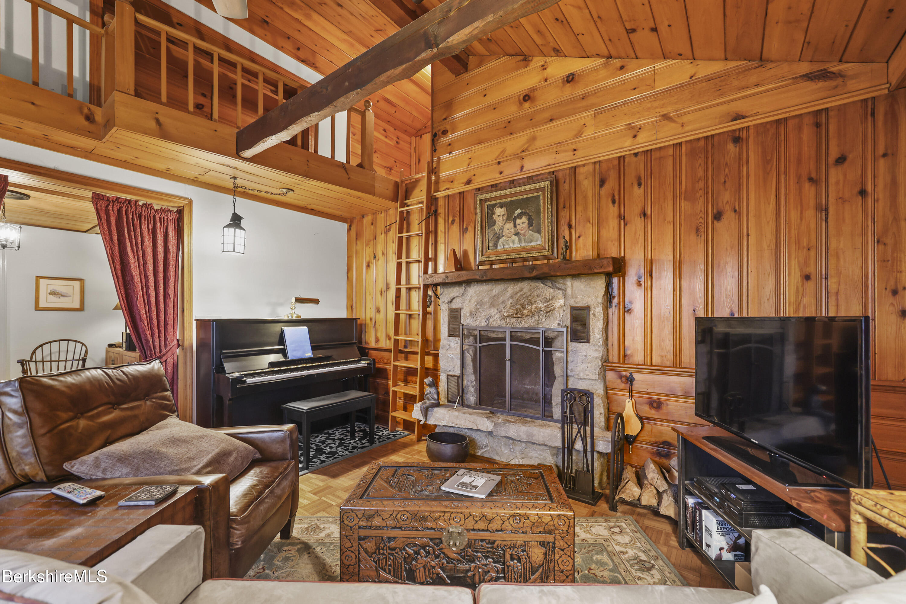 36 West Center Road West Stockbridge, MA 01266 - Photo 7 of 30 a living room with furniture a flat screen tv and a fireplace