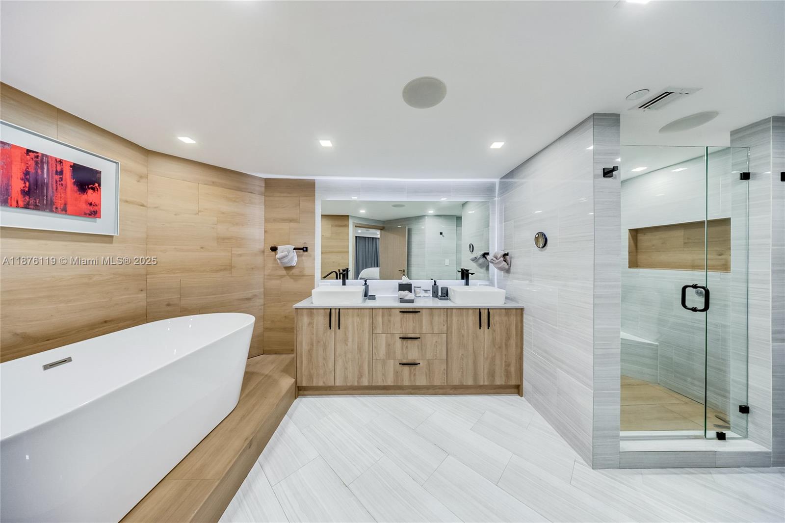 2000 Island Boulevard, Unit 2507 Aventura, FL 33160 - Photo 16 of 21 a bathroom with a double vanity sink mirror and bathtub