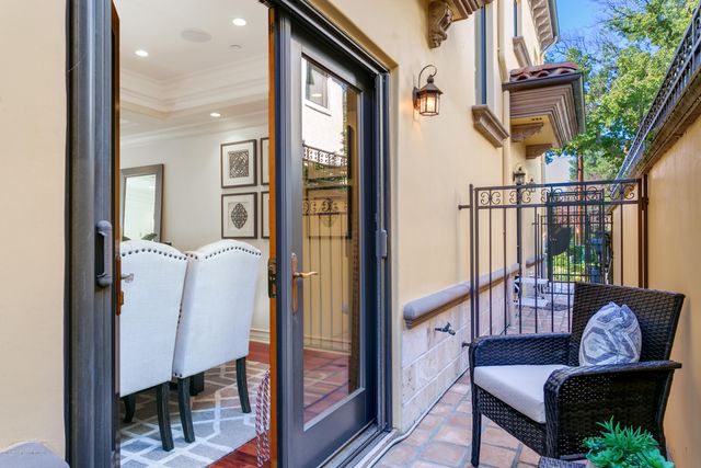 a view of a balcony with furniture