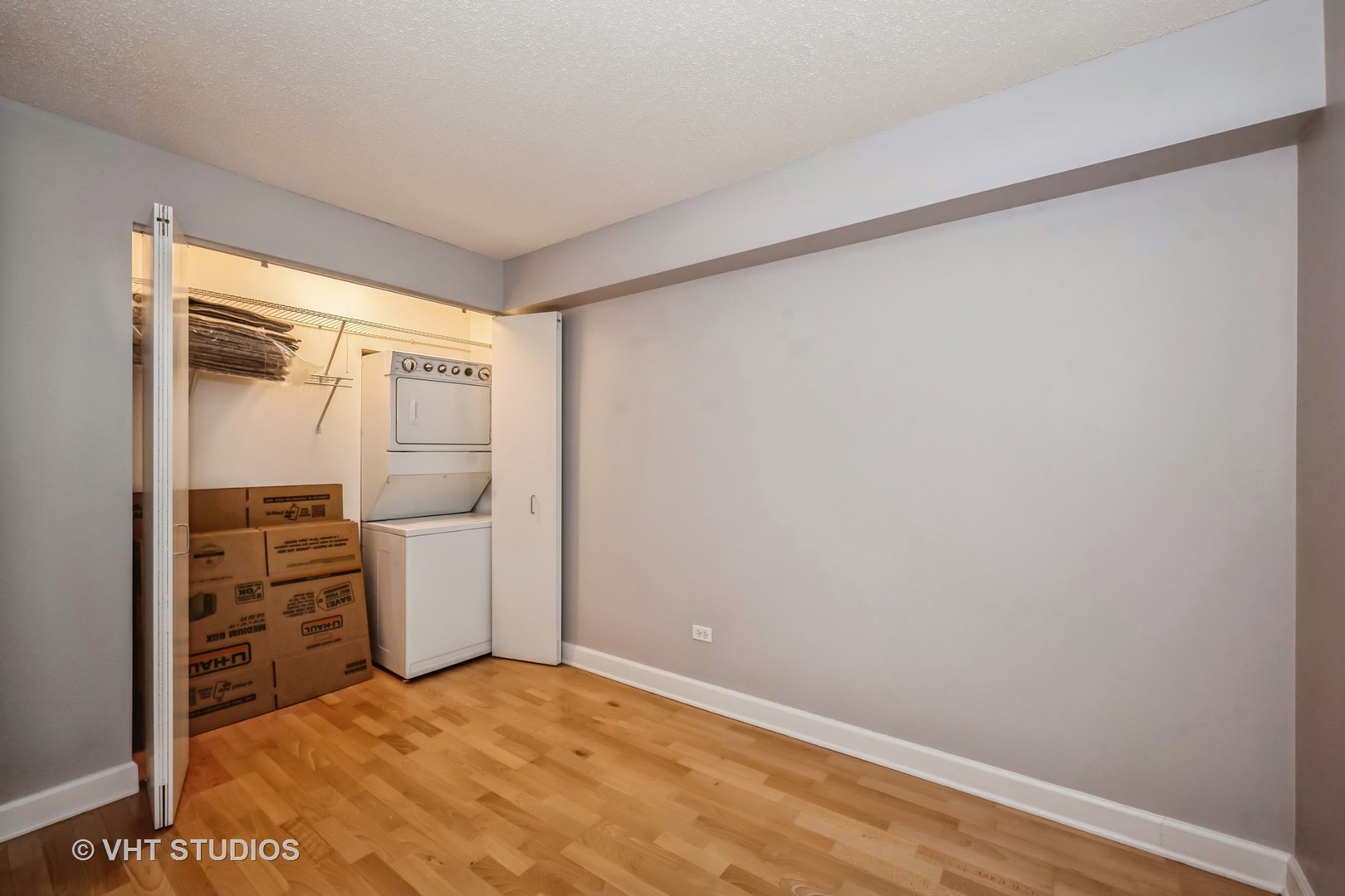 2 East Erie Street, Unit 1606 Chicago, IL 60611 - Photo 11 of 13 a view of empty room with racks on the wall