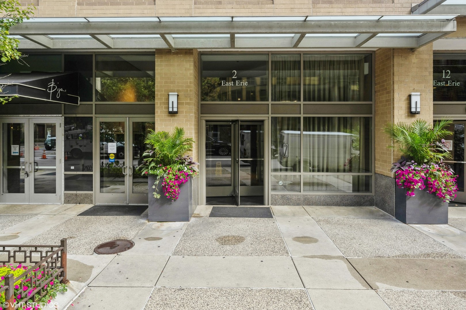 2 East Erie Street, Unit 1606 Chicago, IL 60611 - Photo 2 of 13 a view of a entryway with flower pots