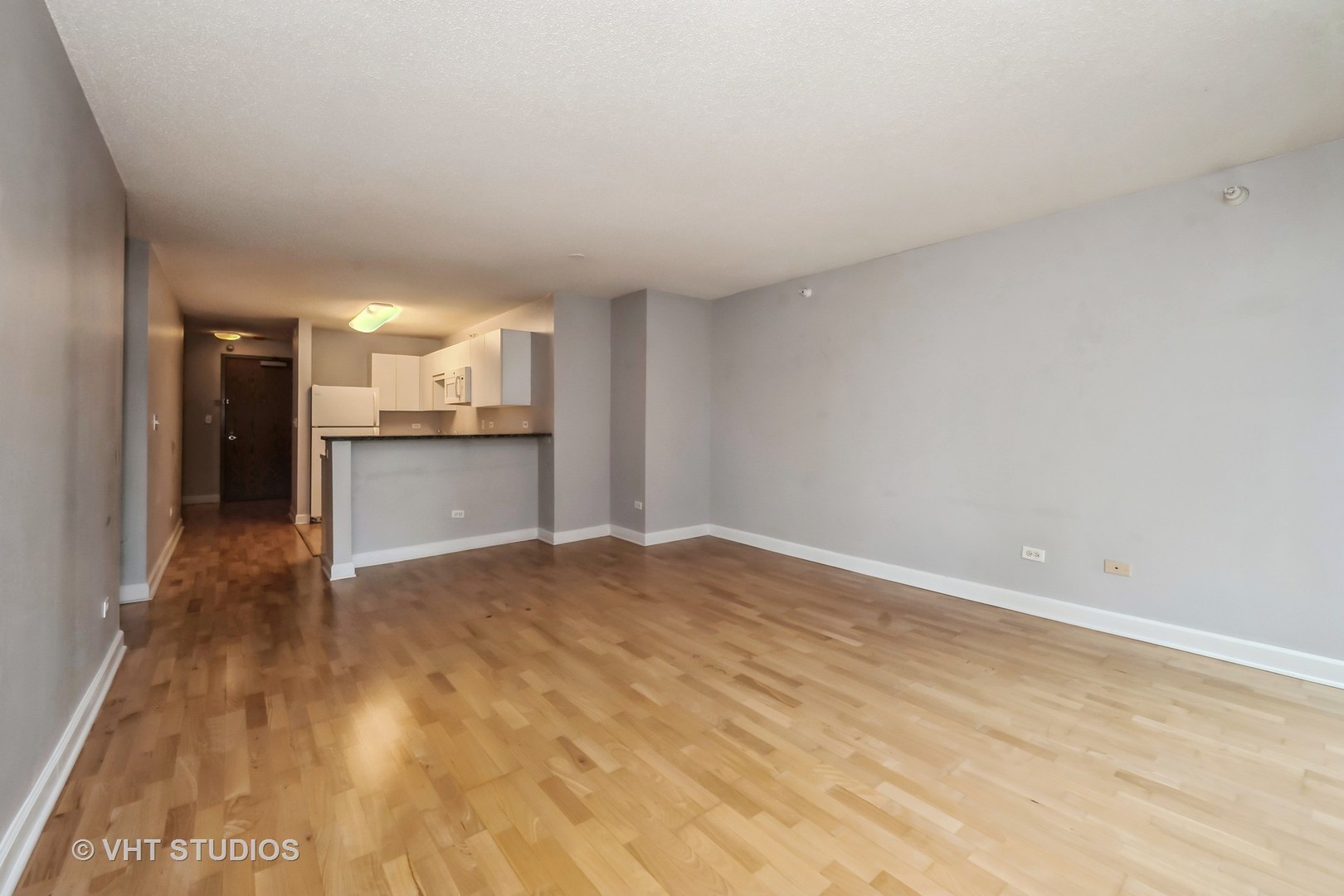 2 East Erie Street, Unit 1606 Chicago, IL 60611 - Photo 6 of 13 a view of a kitchen with a sink and a stove
