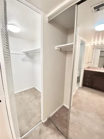 a view of a room with shelf on the wall