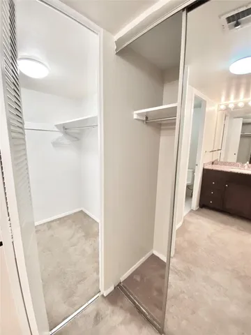 a view of a room with shelf on the wall