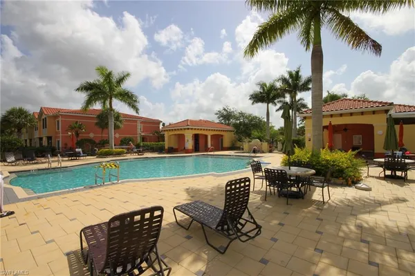 a view of a swimming pool with a patio