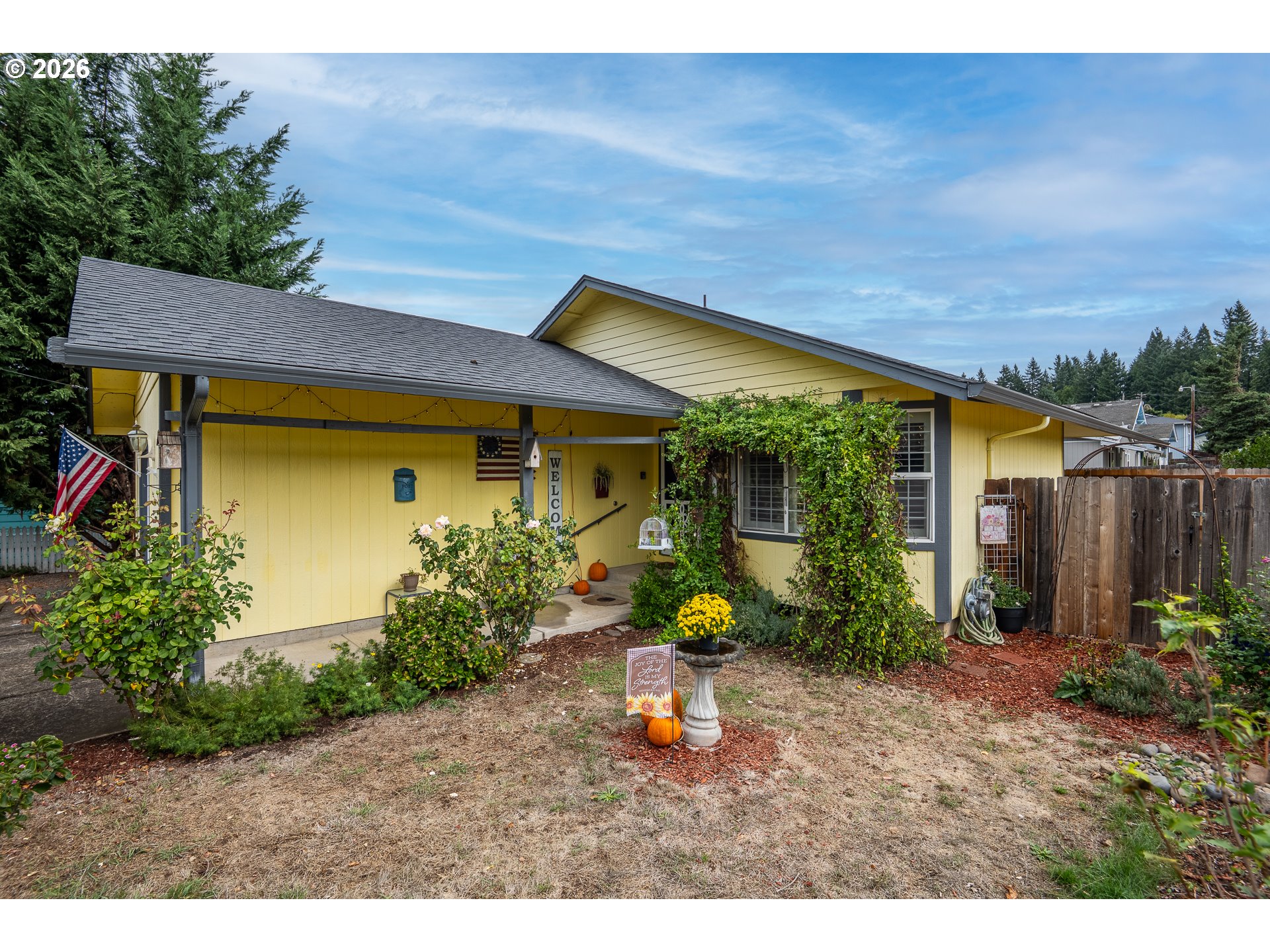 90 South 17th Street Cottage Grove, OR 97424 - Photo 1 of 23 a view of a backyard with potted plants and a table
