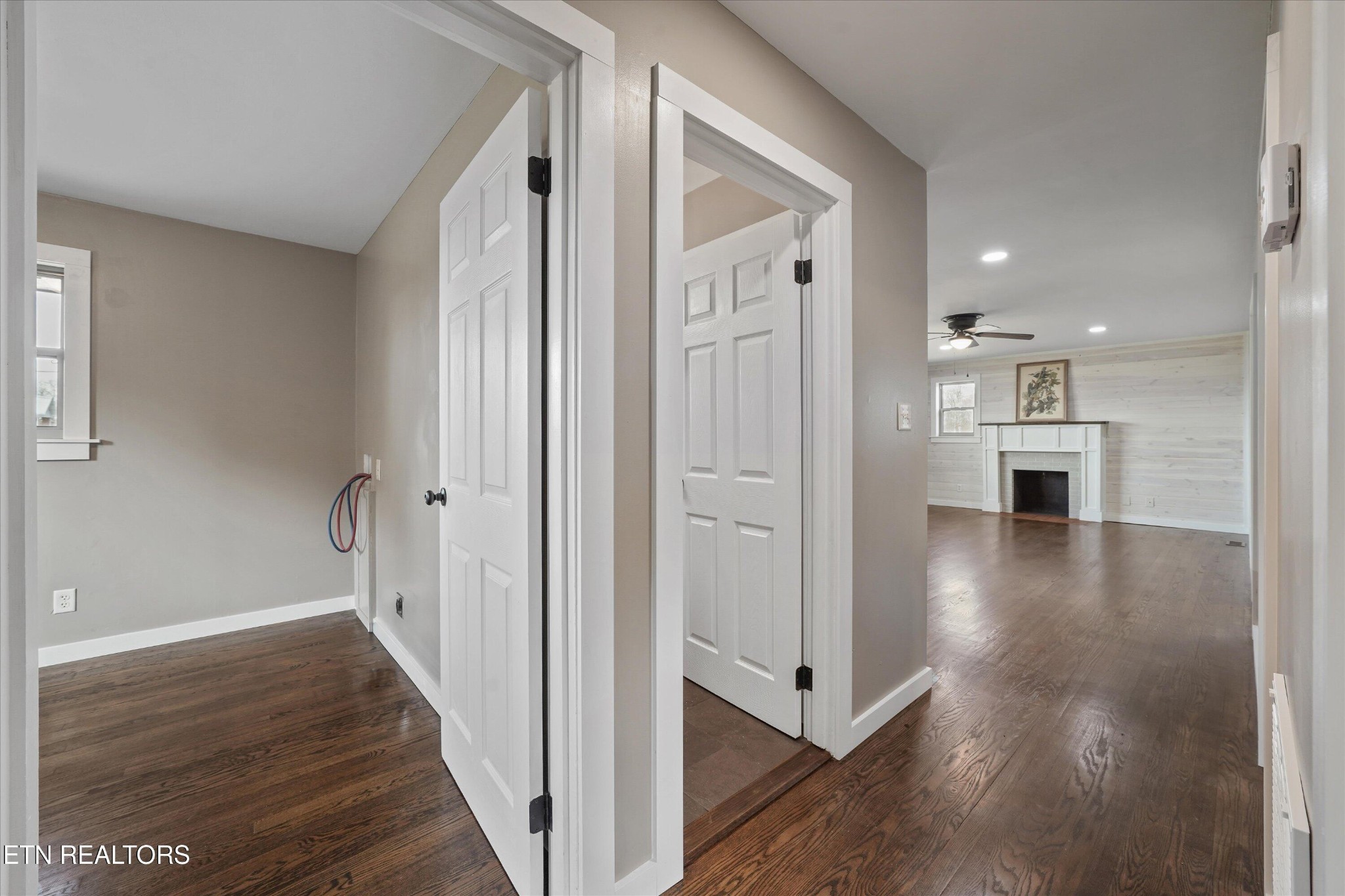 3138 Carpenters Grade Road Maryville, TN 37803 - Photo 19 of 45 a view of a hallway with wooden floor and a kitchen