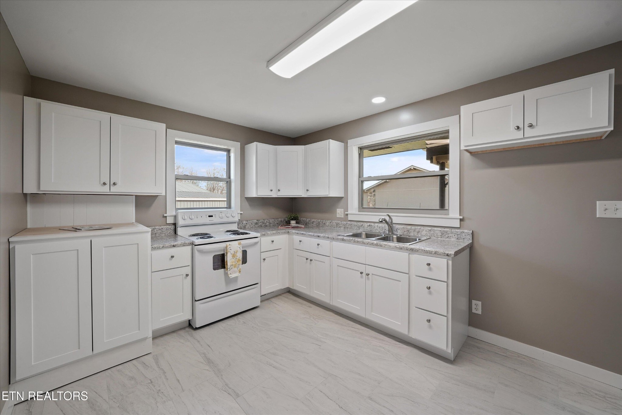 3138 Carpenters Grade Road Maryville, TN 37803 - Photo 23 of 45 a kitchen with white cabinets and white appliances