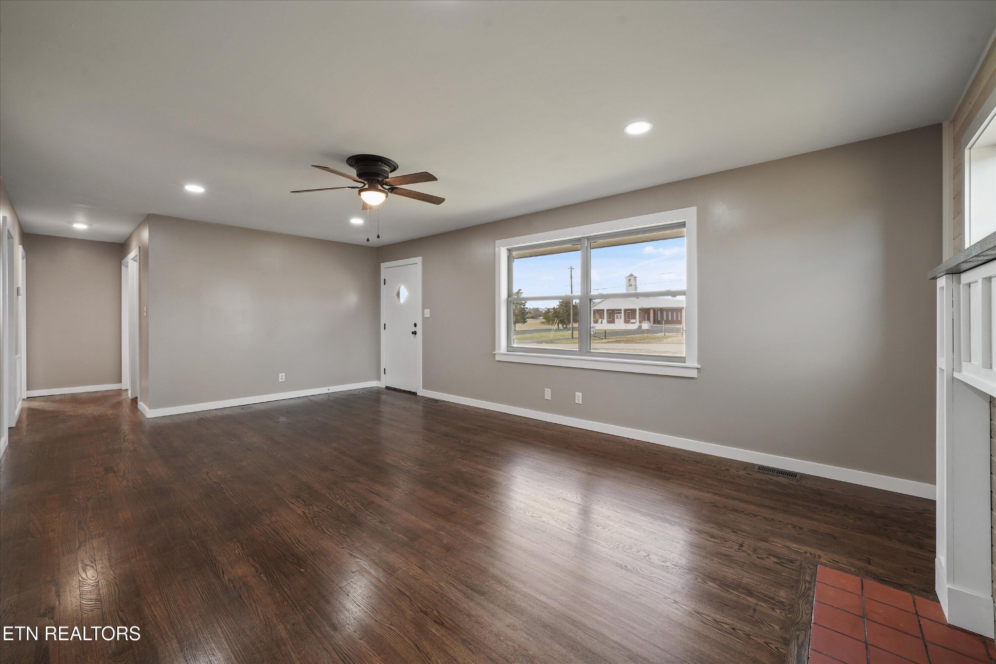 3138 Carpenters Grade Road Maryville, TN 37803 - Photo 25 of 45 a view of an empty room with wooden floor and a window