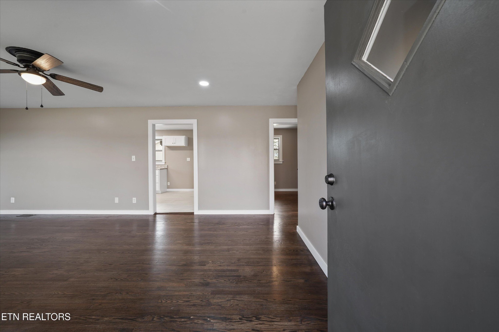 3138 Carpenters Grade Road Maryville, TN 37803 - Photo 26 of 45 a view of an empty room with wooden floor and a ceiling fan