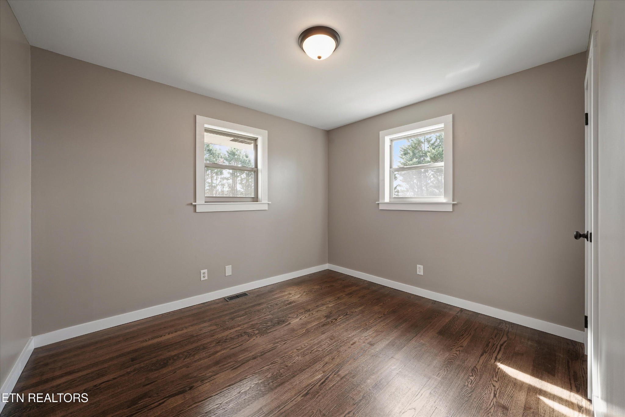 3138 Carpenters Grade Road Maryville, TN 37803 - Photo 29 of 45 an empty room with wooden floor and windows