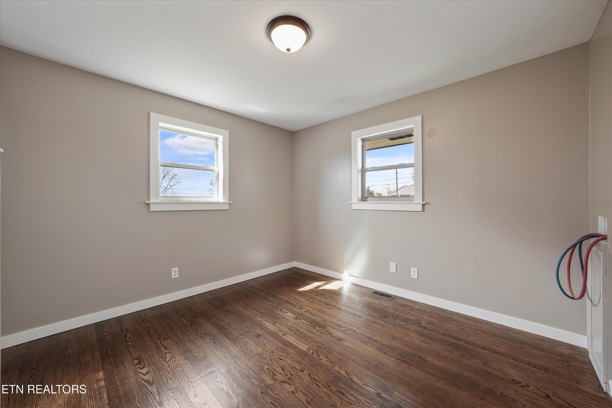3138 Carpenters Grade Road Maryville, TN 37803 - Photo 34 of 45 an empty room with wooden floor and windows