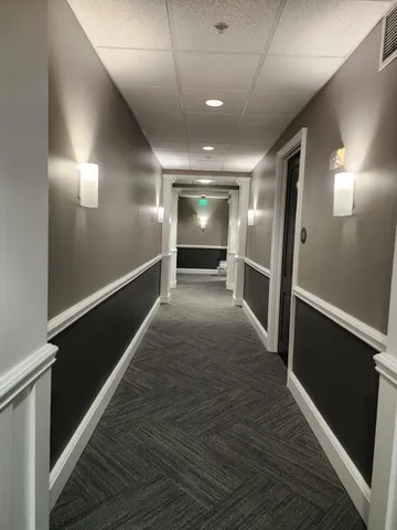 a room with gym equipment and a table