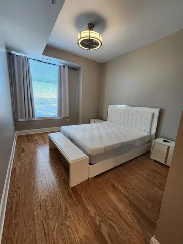 a bedroom with a bed and a sink