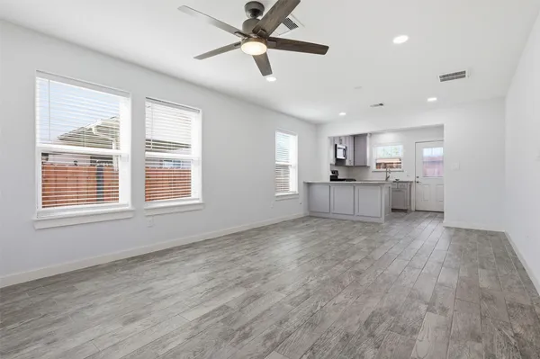 a view of a kitchen with a sink and microwave