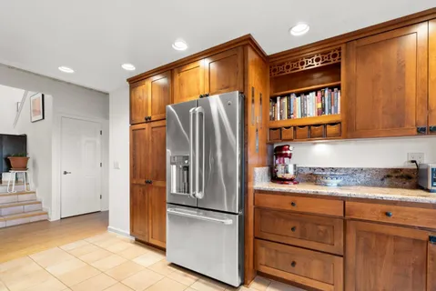 a bedroom with a bed and a view of bedroom