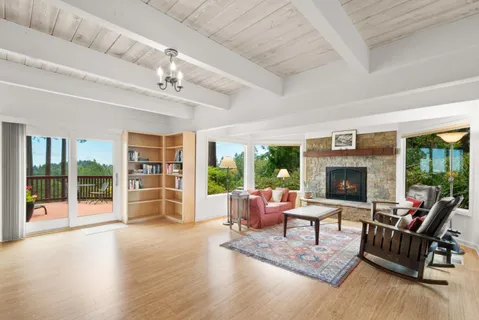 a spacious bathroom with a granite countertop tub sink a mirror a shower and vanity