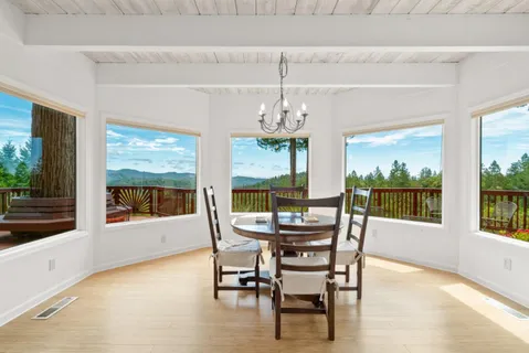 a view of a balcony with wooden fence