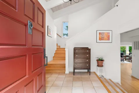 a kitchen with granite countertop a stove and cabinets