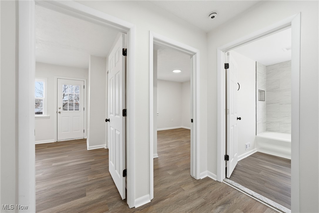 7911 Snow Road Parma, OH 44129 - Photo 20 of 44 Hall with light wood-style flooring and baseboards