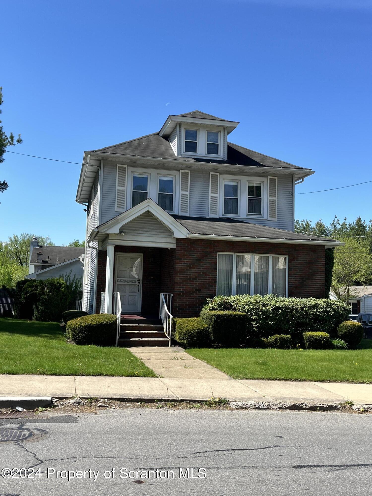 2002 Green Ridge Street Dunmore, PA 18512 - Photo 1 of 43 a front view of a house with a yard