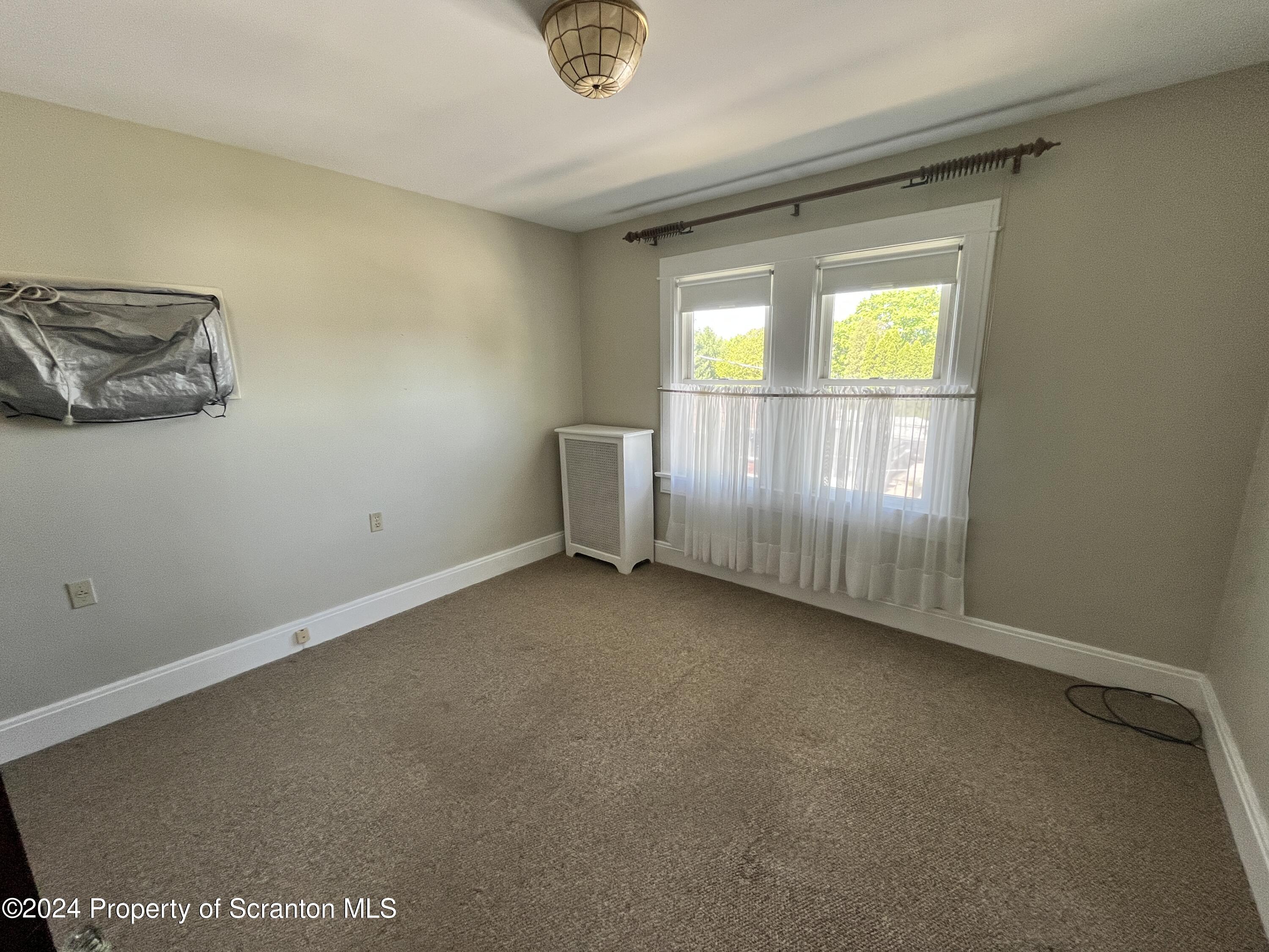 2002 Green Ridge Street Dunmore, PA 18512 - Photo 20 of 43 an empty room with a window