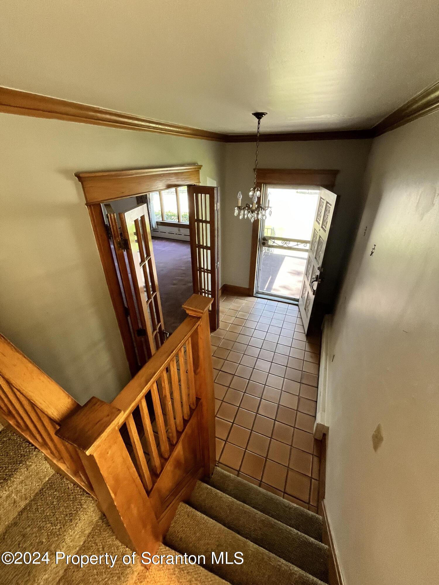 2002 Green Ridge Street Dunmore, PA 18512 - Photo 2 of 43 a view of an empty room with wooden floor and windows