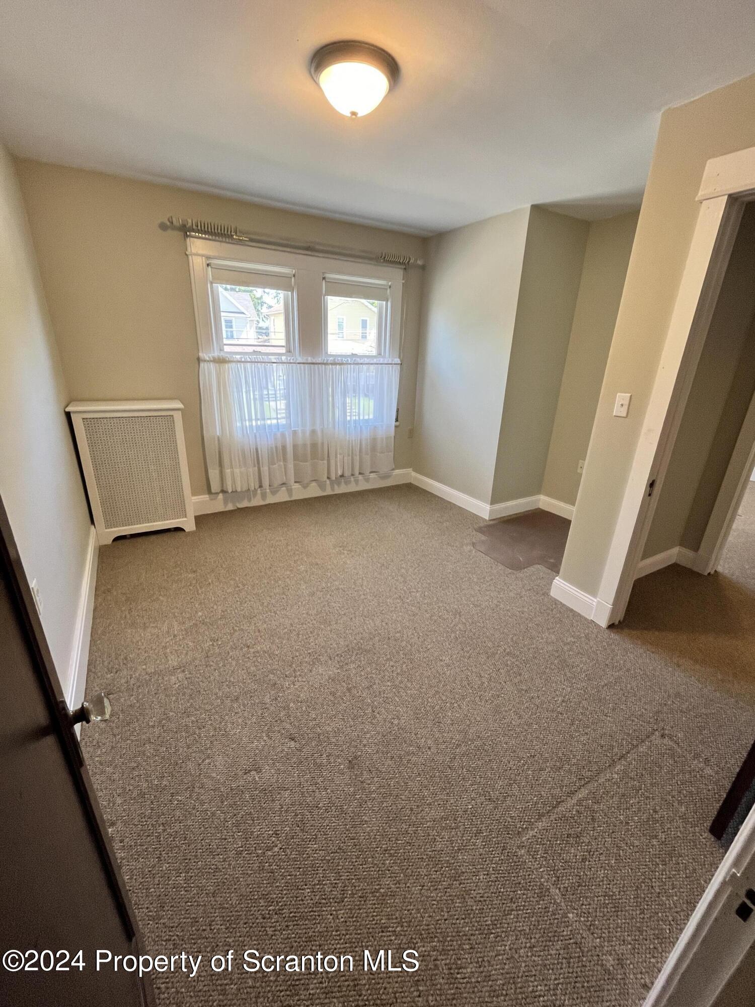 2002 Green Ridge Street Dunmore, PA 18512 - Photo 22 of 43 an empty room with windows
