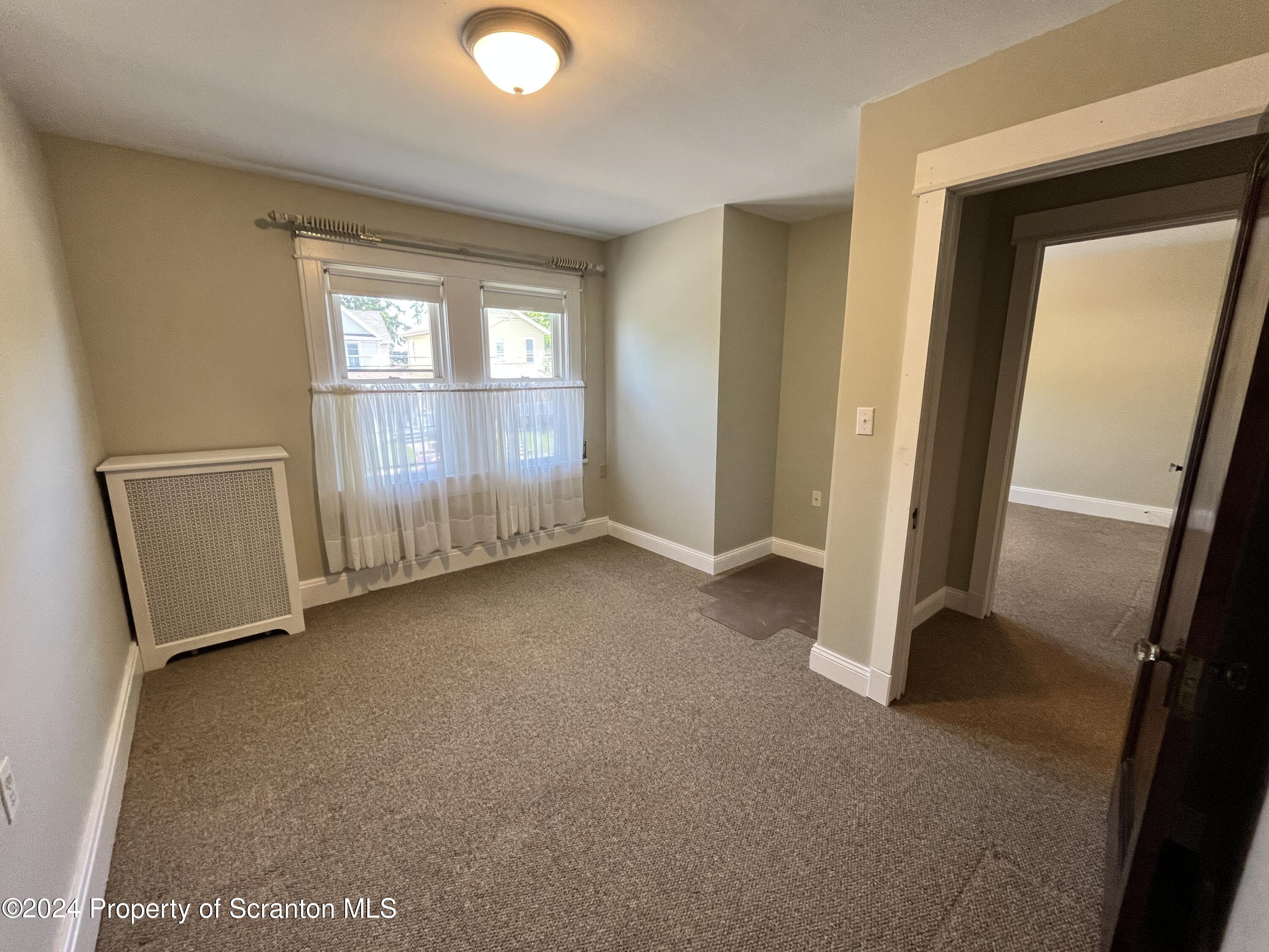 2002 Green Ridge Street Dunmore, PA 18512 - Photo 23 of 43 a view of empty room with windows