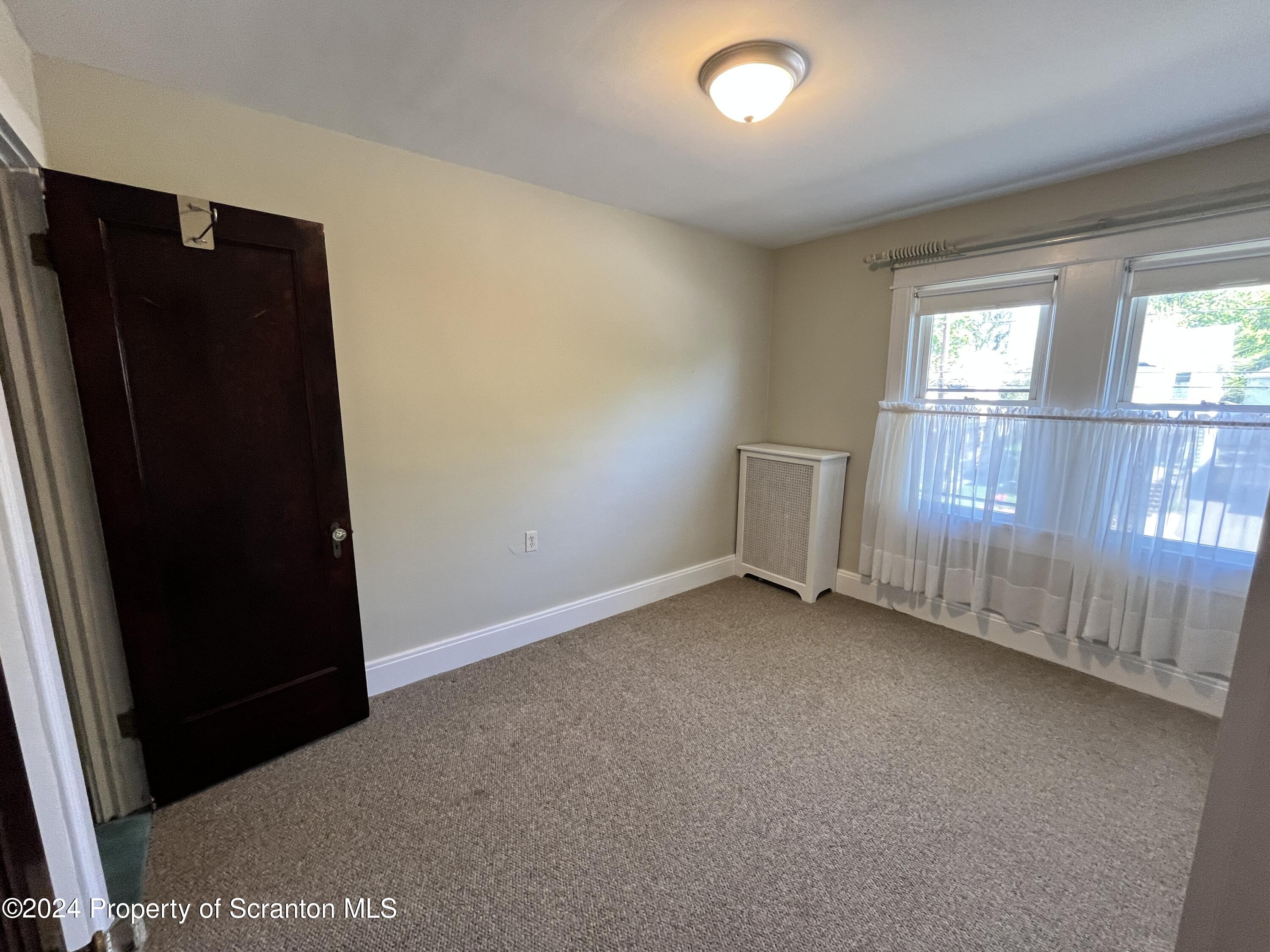 2002 Green Ridge Street Dunmore, PA 18512 - Photo 24 of 43 an empty room with windows