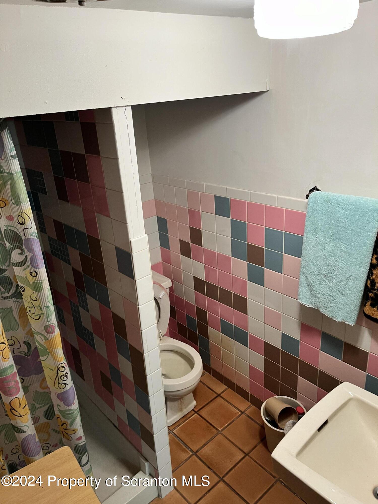 2002 Green Ridge Street Dunmore, PA 18512 - Photo 29 of 43 a bathroom with a toilet and a shower