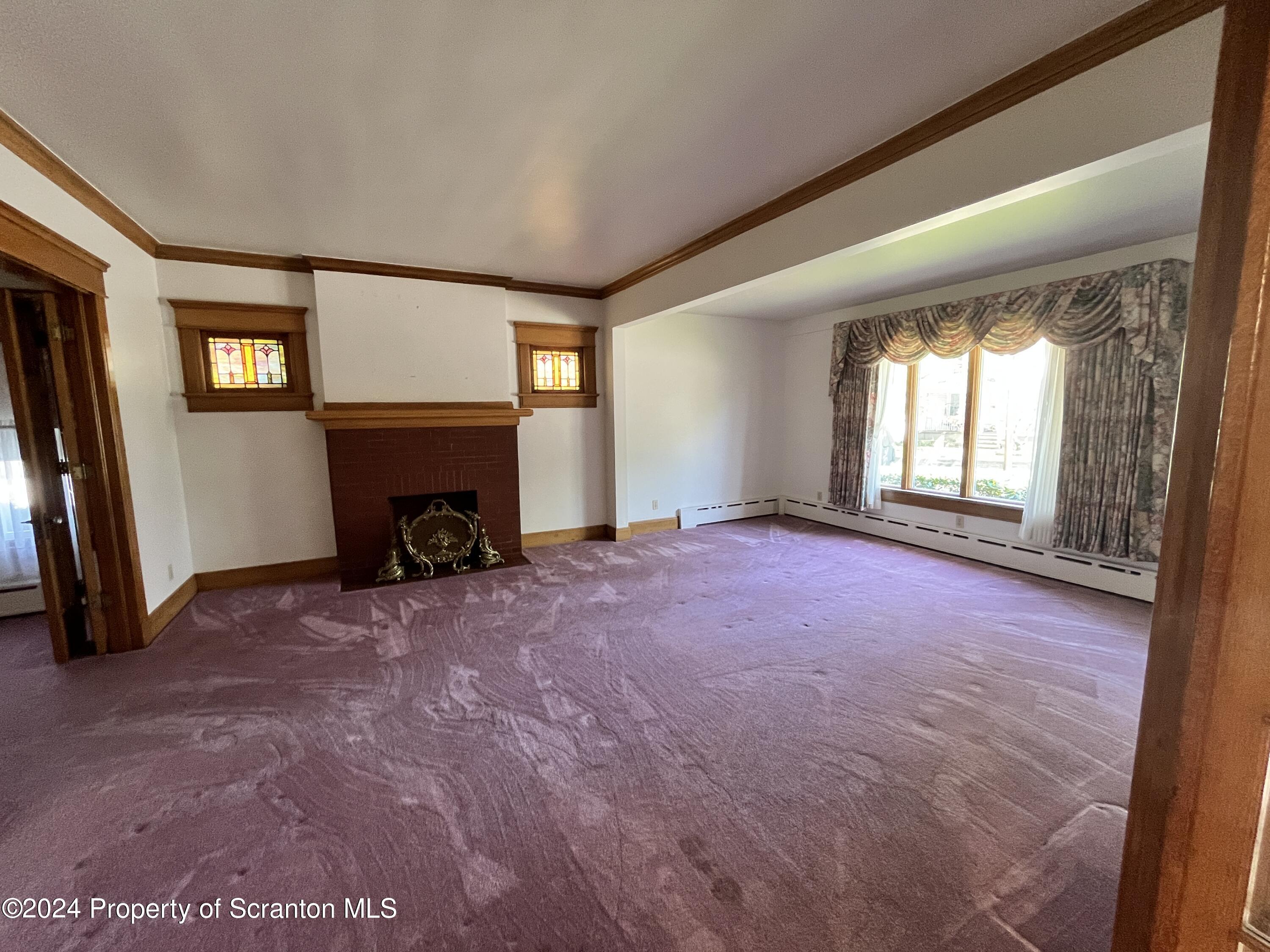2002 Green Ridge Street Dunmore, PA 18512 - Photo 6 of 43 a living room with furniture and a fireplace
