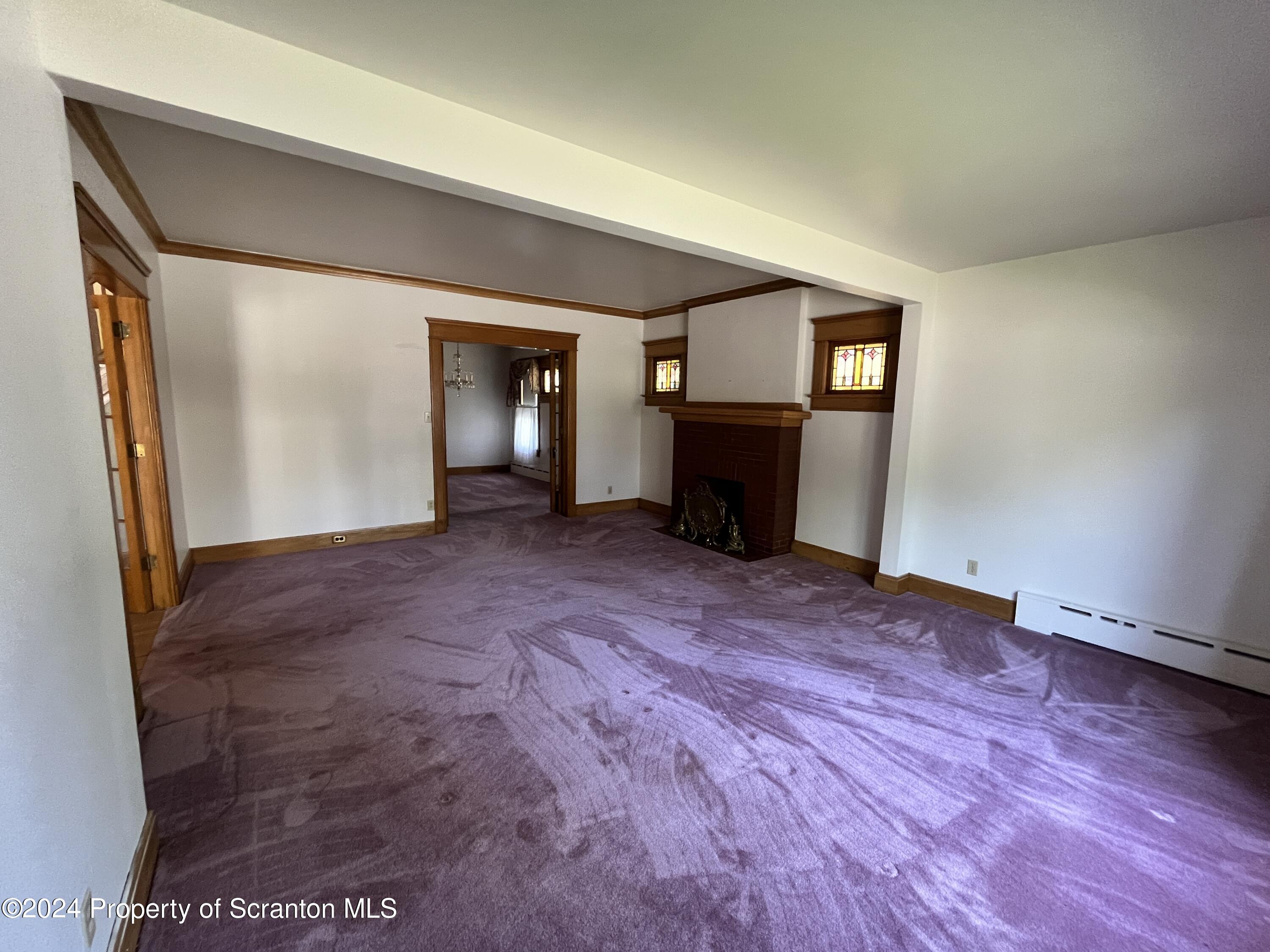 2002 Green Ridge Street Dunmore, PA 18512 - Photo 7 of 43 a view of a room with wooden floor and a ceiling fan
