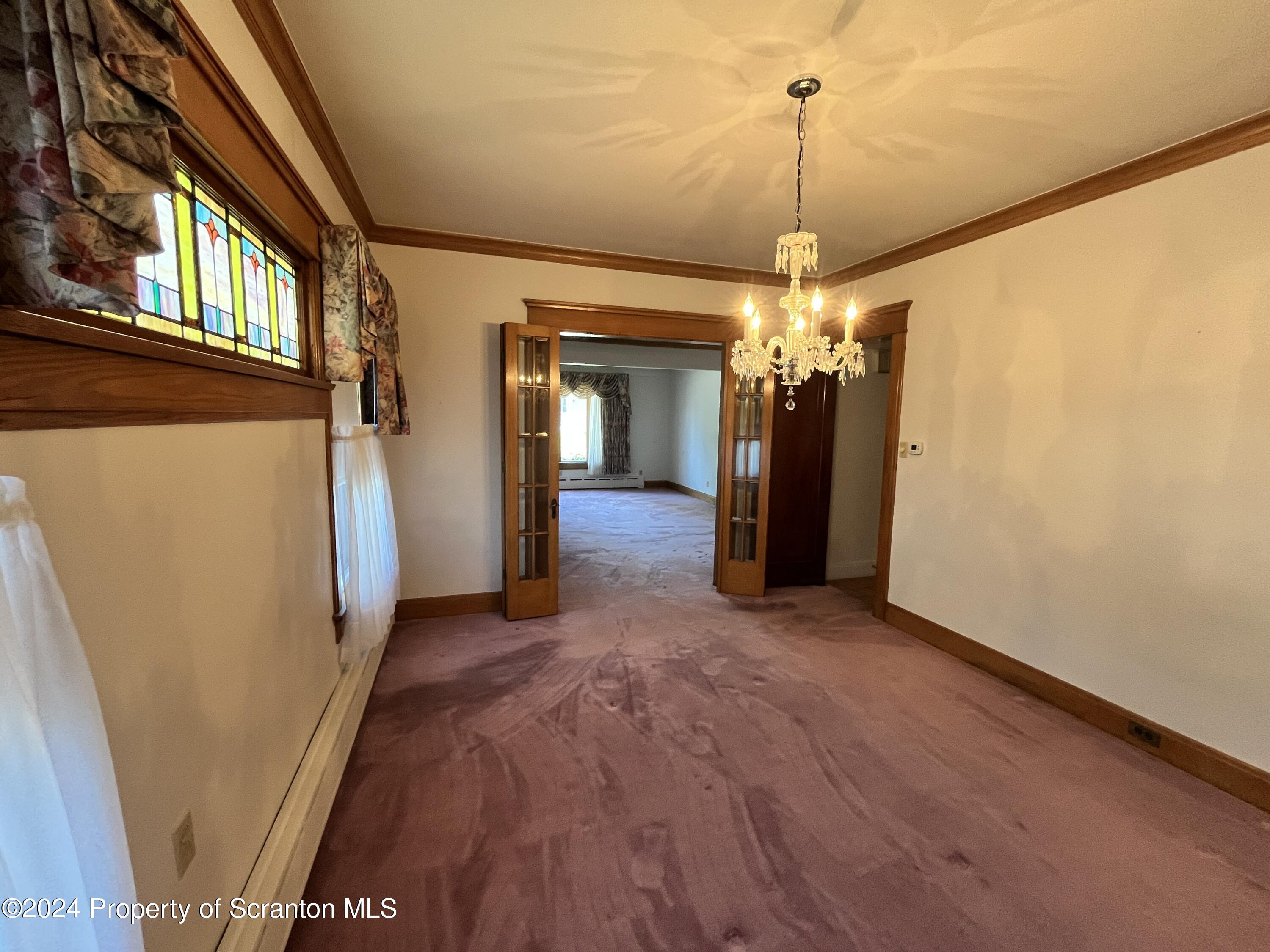 2002 Green Ridge Street Dunmore, PA 18512 - Photo 10 of 43 a view of a hallway with wooden floor and stairs