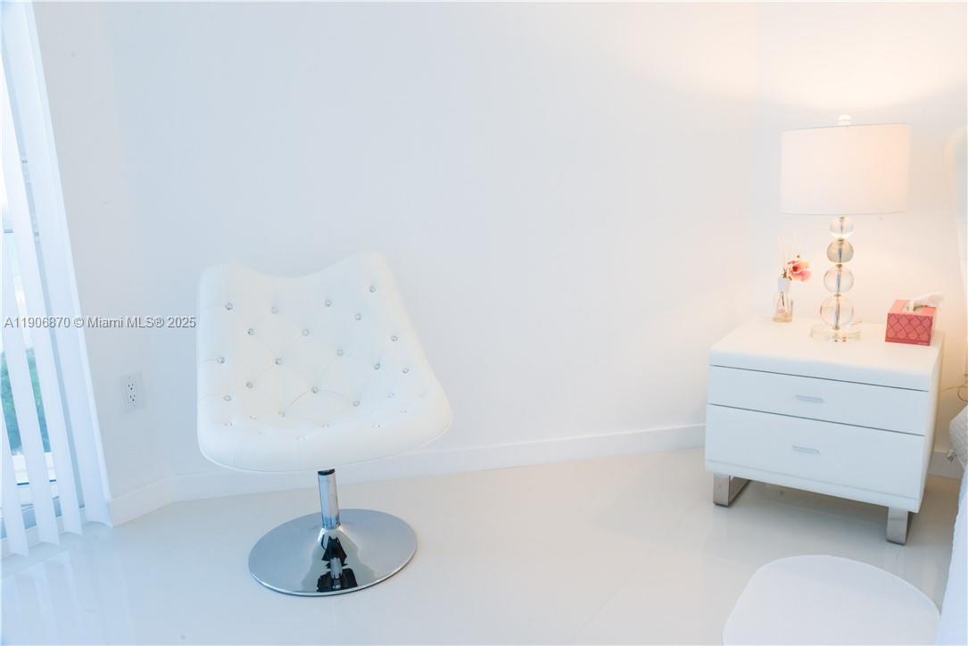 6301 Collins Avenue, Unit 1402 Miami Beach, FL 33141 - Photo 26 of 38 a bathroom with a sink and a mirror