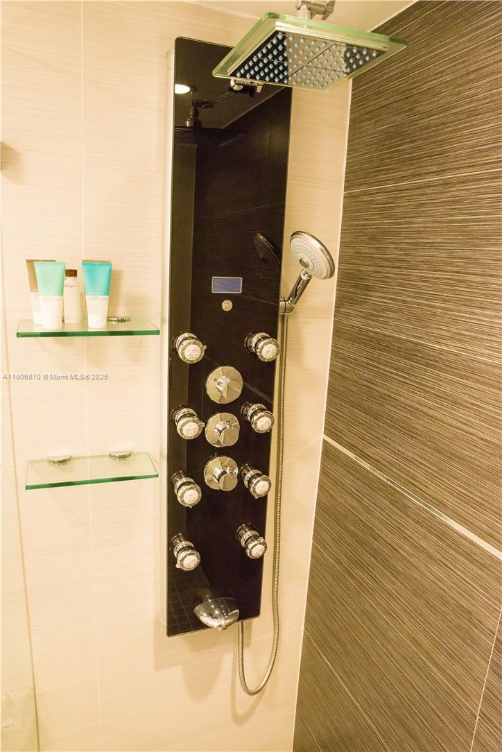 6301 Collins Avenue, Unit 1402 Miami Beach, FL 33141 - Photo 27 of 38 a bathroom with a shower