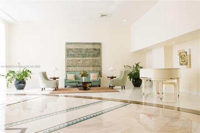 a view of a living room and a potted plant